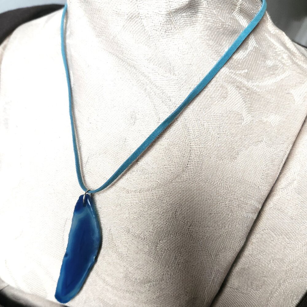 Blue Agate pendant on a light blue faux suede necklace